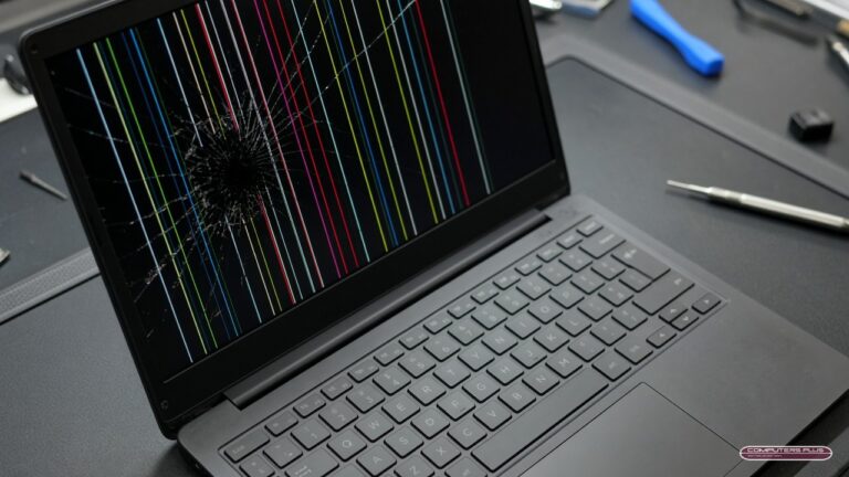 Laptop with a cracked screen and colored lines, waiting for laptop screen replacement in Charleston, WV